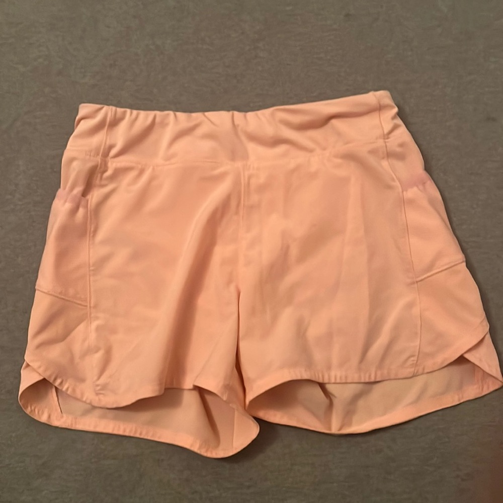 athleta girl peach colored shorts